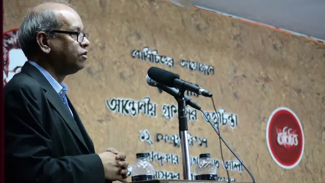Khondokar Shakhawat Ali speaking at a lectern during a seminar on Antonio Gramsci